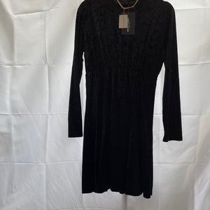 Prettylittlethings black velvet flurry puff dress size M